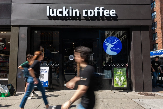 People pass a Luckin Coffee shop in Manhattan on September 04, 2025, in New York City. Photo by Getty Images via AFP