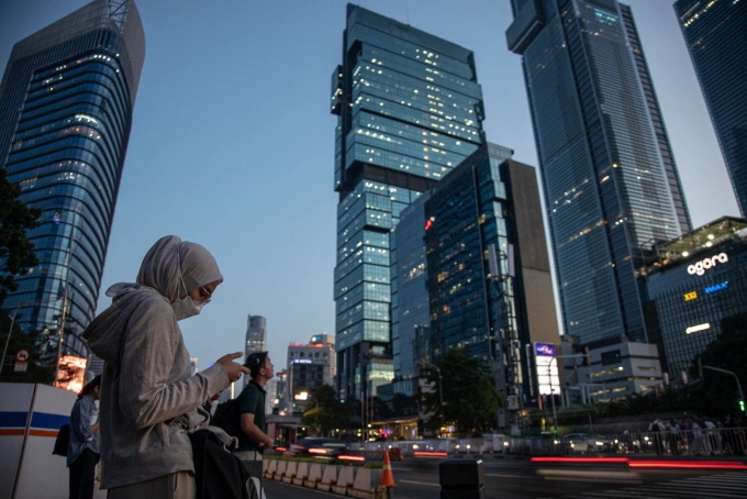 People are in the business district of Jakarta during rush hour in Jakarta, Indonesia, on June 12, 2025. Photo by NurPhoto via AFP