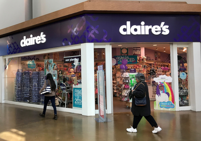 People walk by a Claires store at the Northgate Mall on March 19, 2018 in San Rafael, California. Photo by Getty Images via AFP