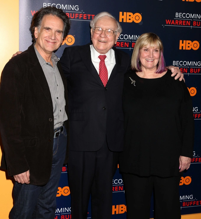 Businessman Warren Buffett (center) with his children Peter Buffett and Susie Buffett at the world premiere of the HBO film Becoming Warren Buffett held at the Museum of Modern Art, Jan. 19, 2017. Photo by ZUMA Press Wire via Reuters