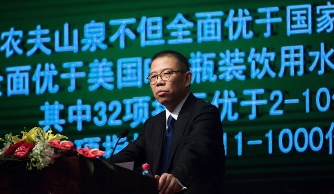 Zhong Shanshan, Chairman of Nongfu Spring Co., Ltd., delivers a speech at a press conference in Beijing, China, May 6, 2013. Photo by Imaginechina via AFP