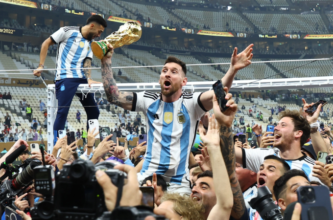 Lionel Messi holds the trophy after Argentina defeated France in the 2022 World Cup final. Photo by Reuters