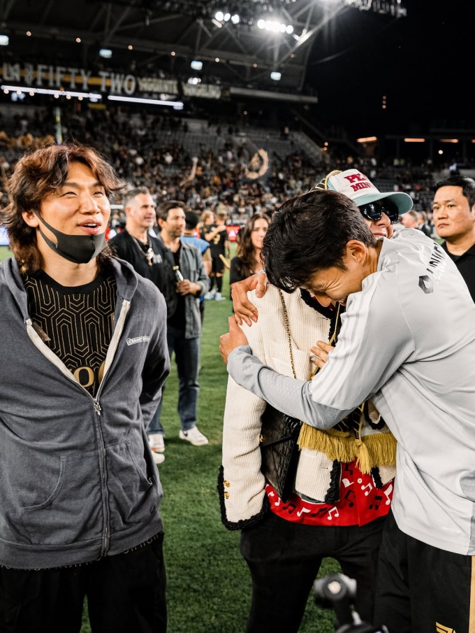 Son Heung-min and G-Dragon share a tight embrace next to Daesung of BIGBANG after the LAFC game against Orlando City at BMO Stadium in Los Angeles, on April 5, 2026. Photo by Instagram/@lafc