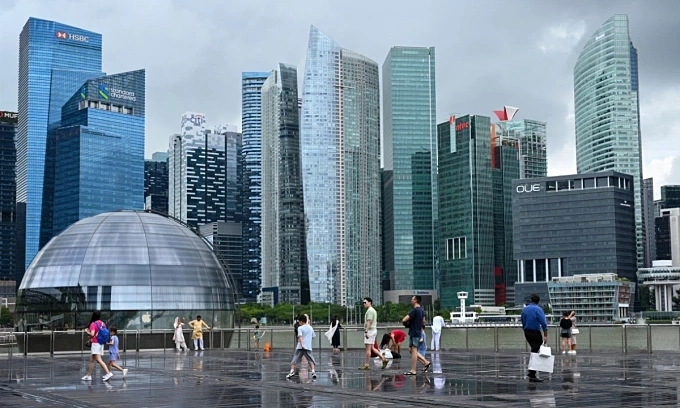 People gather on the boardwalk at Marina Bay in Singapore on Jan. 9, 2024. Photo by AFP