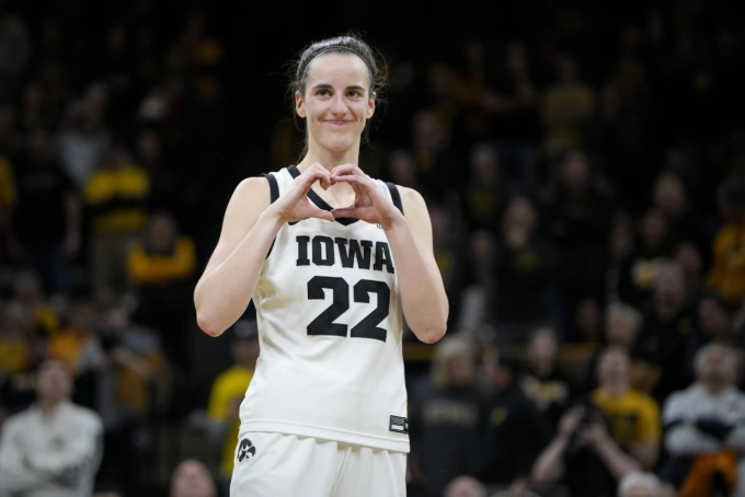 Caitlin Clark makes a gesture after the NCAA college basketball game between Iowa and Michigan on Feb. 15, 2024. Photo by AP