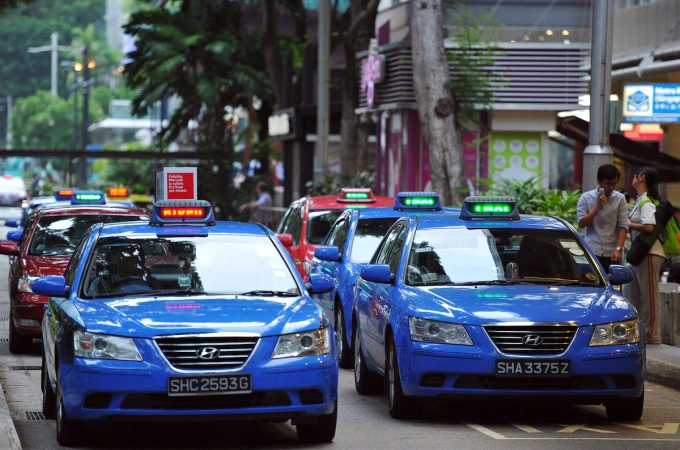 Taxis at the Lucky Plaza taxi stand in Singapore. Photo by SPH Media via AFP