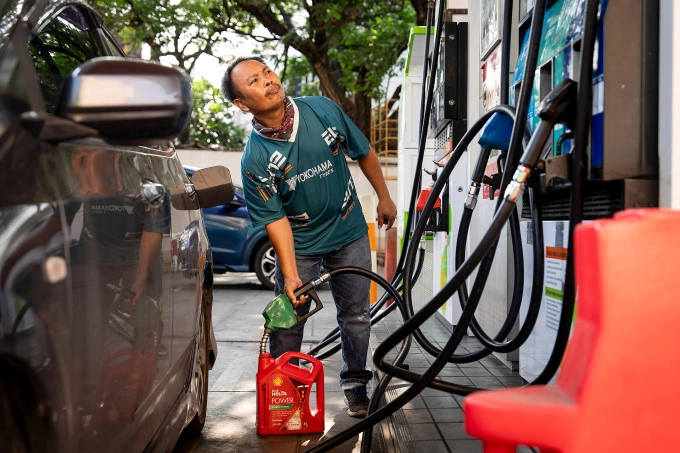 A man refills a small container of gas at a Bangchak Corporation Public Company Limited station in Bangkok, Thailand, on March 26, 2026. Photo by Anadolu via AFP
