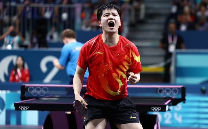 Chinese table tennis player Fan Zhendong celebrates after defeating Truls Moregard to win the Olympic gold medal at the South Paris 4 arena in Paris, France, on Aug. 4, 2024. Photo by Reuters
