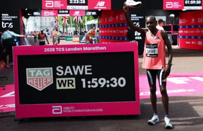 Sebastian Sawe stands next to his historic result after the London Marathon on April 26, 2026. Photo by Reuters
