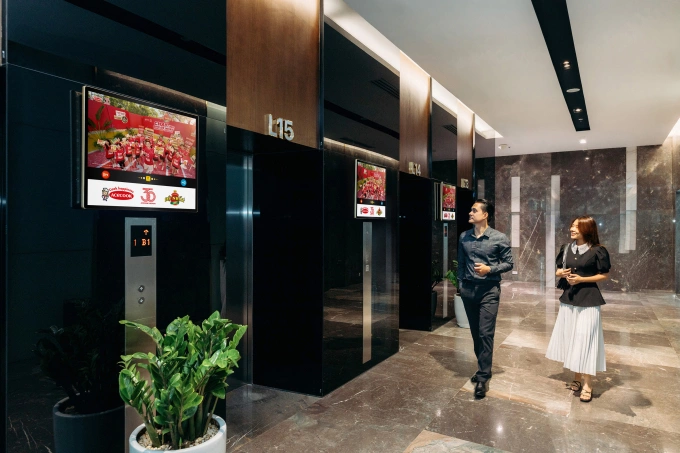 Dual advertising screens installed in office lobby. Photo courtesy of Chicilon Media