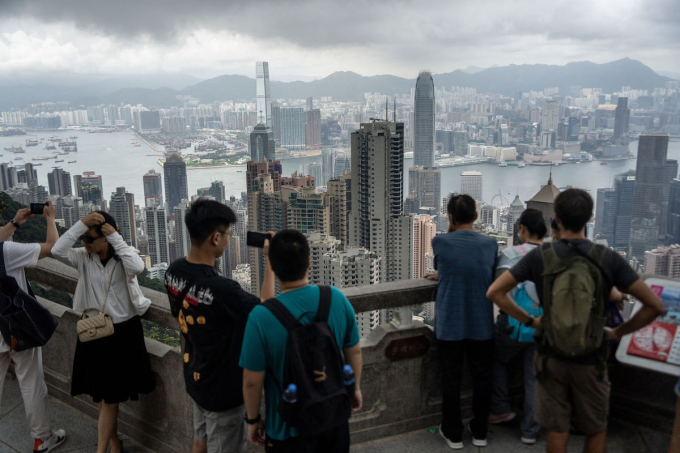 People are looking at the Hong Kong Skyline from the peak in Hong Kong on June 18, 2024. Photo by NurPhoto via AFP