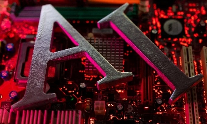 This illustration taken on June 23, 2023 shows the words AI (Artificial Intelligence) placed on a computer motherboard. Photo credit: Reuters