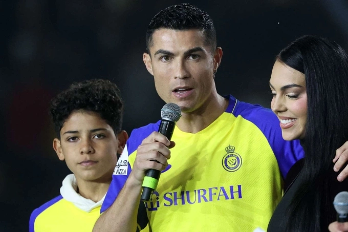Cristiano Ronaldo with his fiancée Georgina Rodriquez and his eldest son Cristiano Jr. at Al Nassr. Photo by AFP