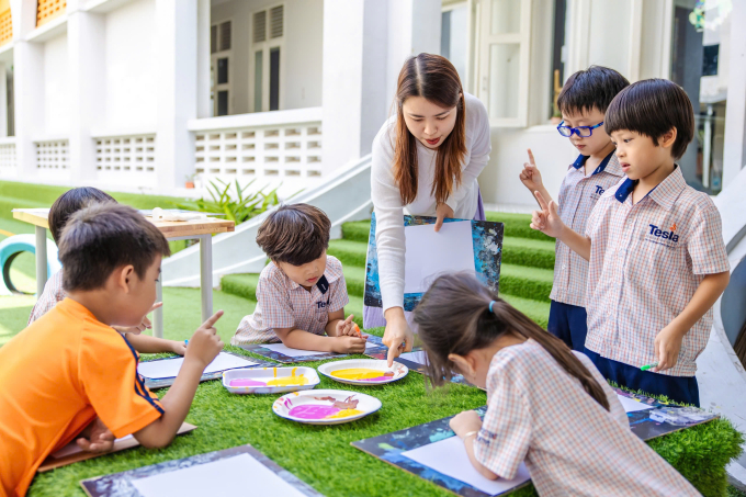 Students join an outdoor art activity, reflecting Tesla Educations project-based learning approach. Photo courtesy of Tesla Education