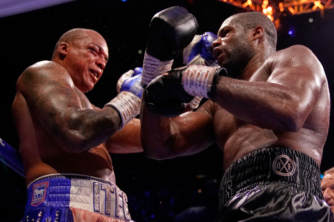 Britains Daniel Dubois (R) lands a blow on Britains Fabio Wardley during their WBO World Heavyweight boxing title bout in Manchester, Saturday, May 9, 2026. Photo by AP