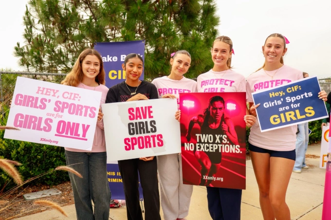 Five female students protest against the participating of transgender athletes in womens events. Photo by X/@SophiaSLorey