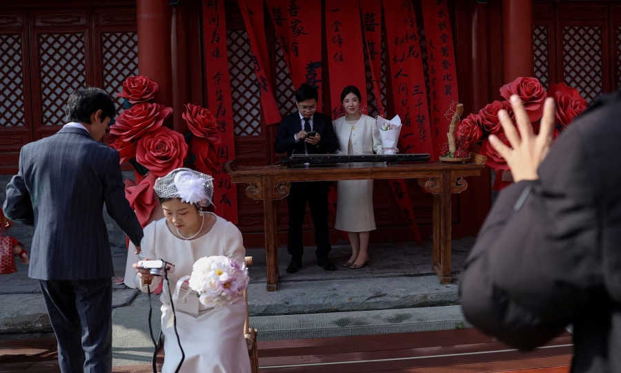 Marriages in China halve over decade as birth rate hits record low