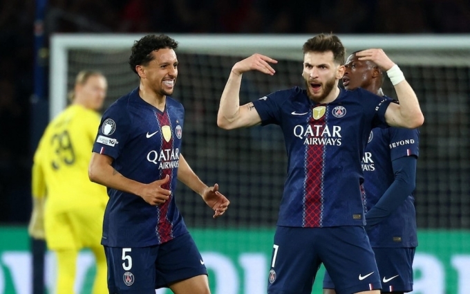 Khvicha Kvaratskhelia (R) celebrates a goal with Marquinhos during the PSG-Bayern Munich match at the Parc des Princes in Paris, France, in the first leg of the Champions League semifinals on April 28, 2026. Photo by Reuters