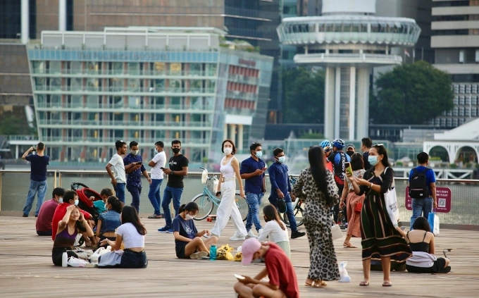People gather on a pier near Marina Bay Sands in Singapore on Sept. 29, 2021. Photo by Unsplash.