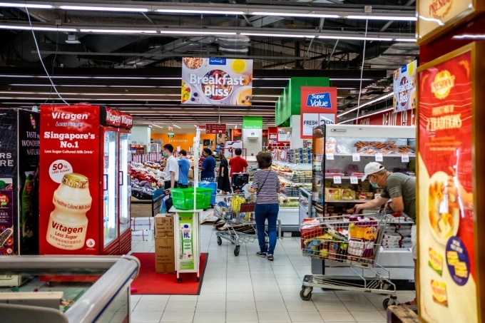 Singaporeans shop at the NTUC FairPrice Xtra at NEX Mall in Serangoon on March 26, 2020. Photo by NurPhoto via AFP