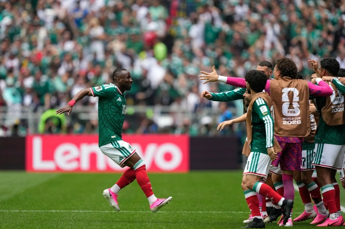 Mexicos Julian Quinones, left, celebrates after scoring the opening goal during the World Cup Group A soccer match between Mexico and South Africa in Mexico City, Thursday, June 11, 2026. Photo by AP