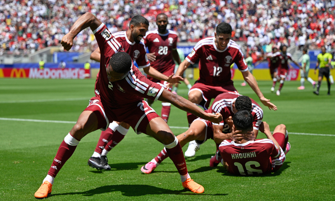 Qatar earn first ever World Cup point with late goal
