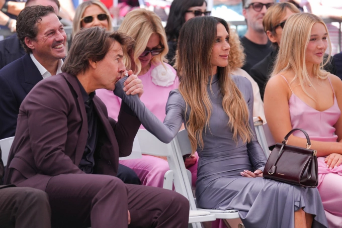 Tom Cruise (L), Victoria Beckham, and their daughter Harper at the star unveiling ceremony on the Hollywood Walk of Fame in honor of David Beckham in Los Angeles, California, on June 12, 2026. Photo by AP
