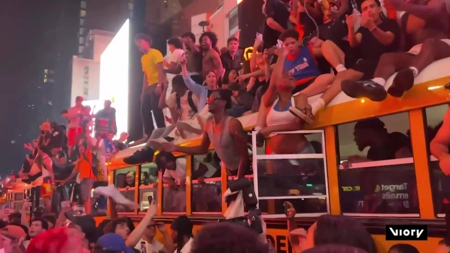 Smashed vehicles, littered streets in NYC as hundreds of fans erupt in chaotic celebration of Knicks' first NBA title in 53 years