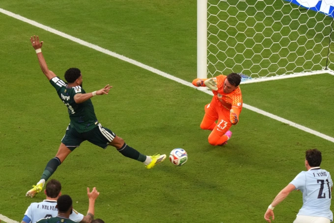 Saudi Arabian defender Al Amri (in green) scores a rebound goal, beating Uruguay goalkeeper Fernando Muslera in their opening match of Group H at the 2026 World Cup, in Miami, USA, on June 15, 2026. Photo by AP