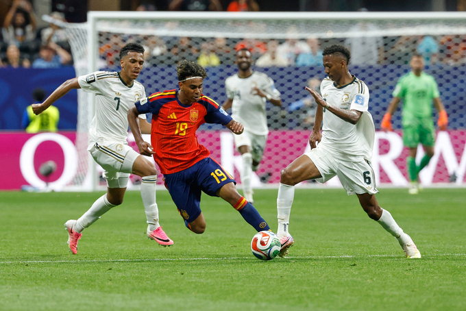 Lamine Yamal (C) contests the ball with Musab Al Juwayr (L) and Nasser Al Dawsari during the World Cup Group H match between Spain and Saudi Arabia in Atlanta on June 21, 2026. Photo by AP