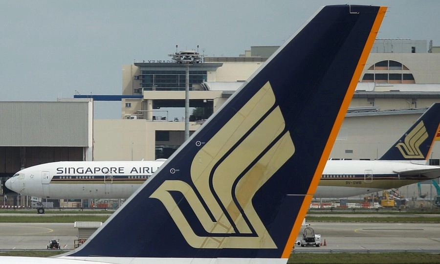 Singapore Airlines passenger jailed for groping stewardess as friends laugh at her