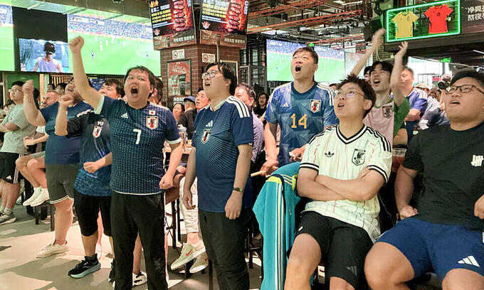 Fans in China cheer Japan at World Cup