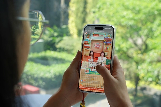 A woman watches a livestream introducing products on Shopee Live. Photo courtesy of Shopee Vietnam