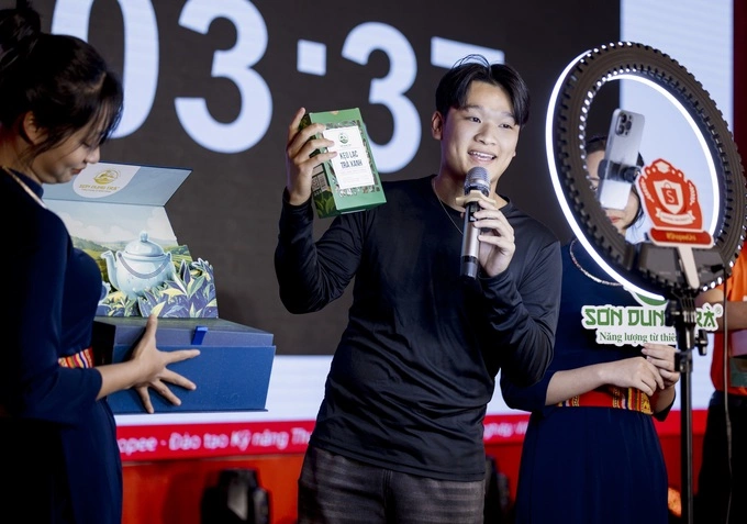 A man holds a product during a livestream session. Photo courtesy of Shopee Vietnam