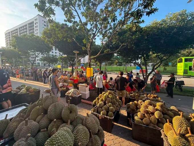 People queue for a free durian giveaway in Singapore. Photo from Facebook/Ng Berlin