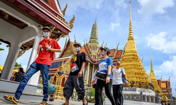Tourists visit the Grand Palace in Bangkok, Thailand, on June 7, 2022. Photo by AFP