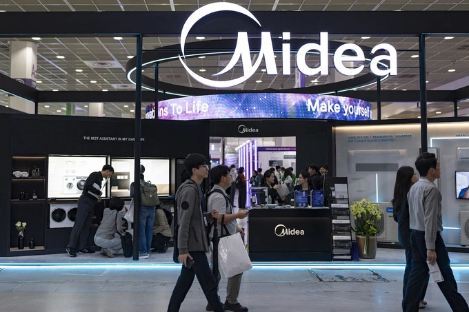 Visitors tour the Midea booth at the Korea Electronics Show (KES) 2025 at COEX in Seoul, South Korea, on October 21-24, 2025. Photo by NurPhoto via AFP