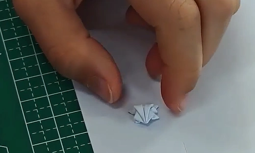 Hopping into history: Chinese schoolboy lands Guinness record with tiny origami frog feat