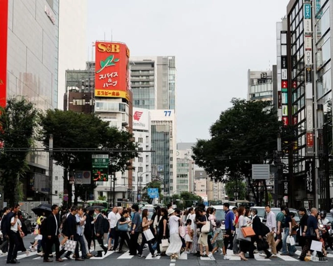 People walk in a shopping district in Tokyo, Japan, on Jun 16, 2026. Photo by AFP