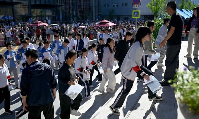 Students enter a school on the first day of Chinas National College Entrance Examination (NCEE) known as gaokao, in Beijing on June 7, 2026. Photo by AFP