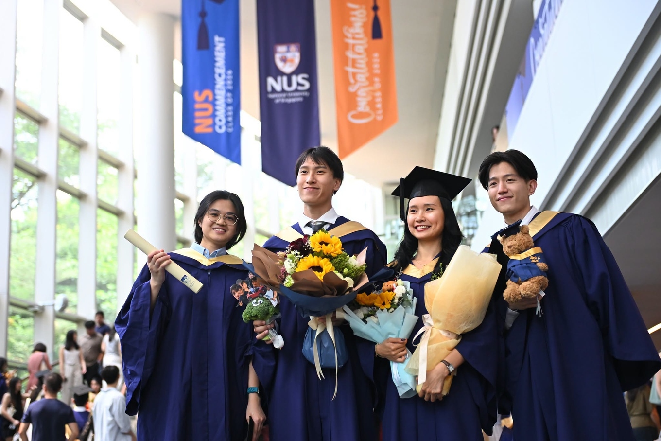Graduates pose for photos after a commencement ceremony at the National University of Singapore (NUS) in Singapore, Jul. 23, 2026. Photo from the universitys Facebook page