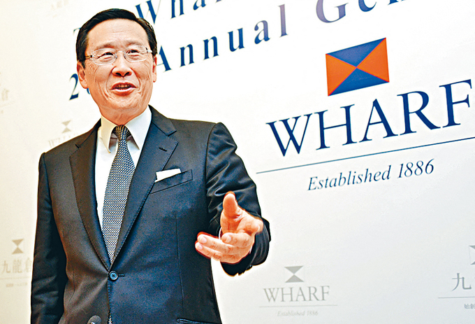Peter Woo, Chairman of The Wharf (Holdings) Limited and Wheelock and Company Limited, speaks at a press conference in Hong Kong, China, June 6, 2013. Photo by Imaginechina via AFP