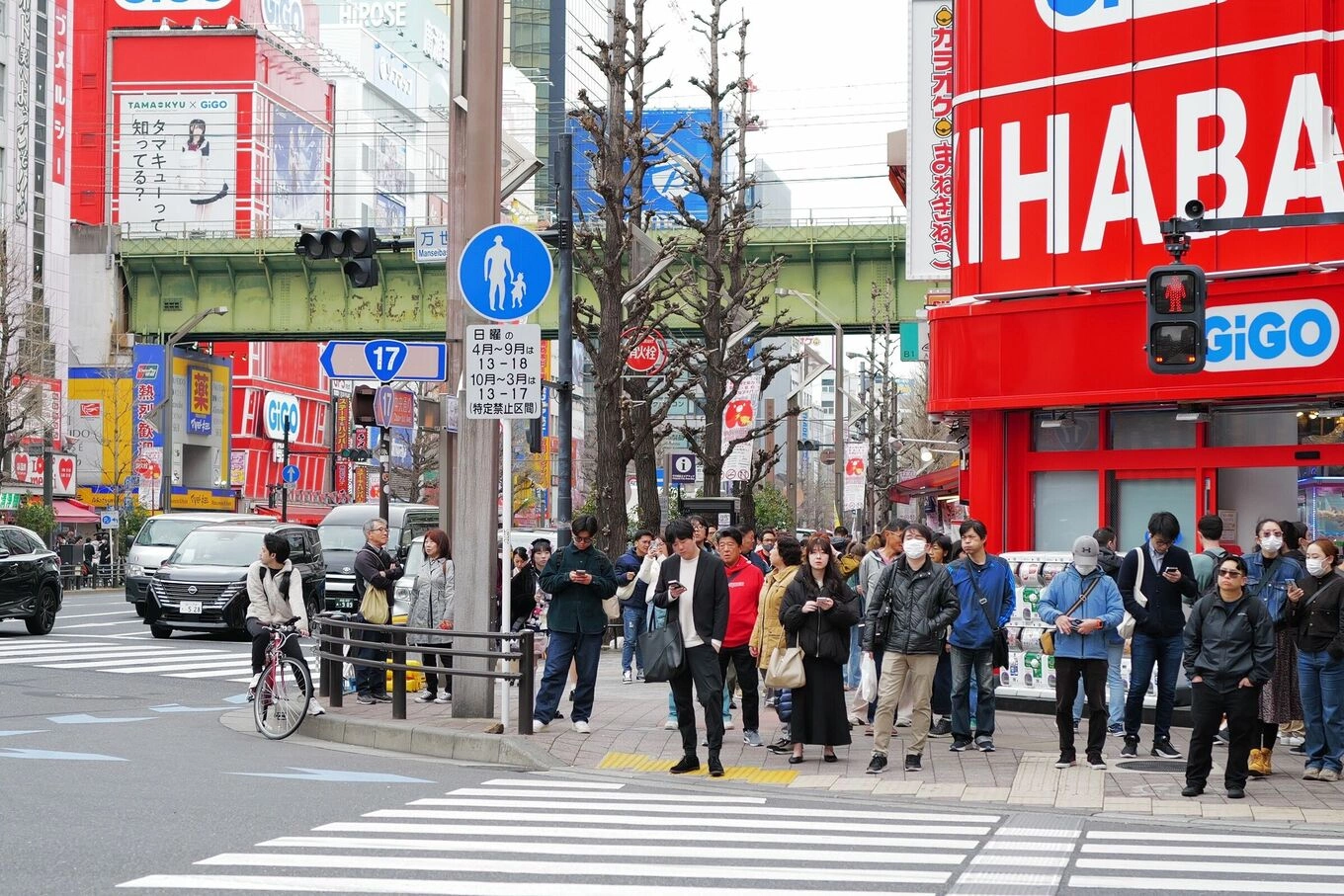 Bustling Tokyo intersection with pedestrians and vibrant storefronts in Tokyo, Japan, April. 2024. Photo by Pexels