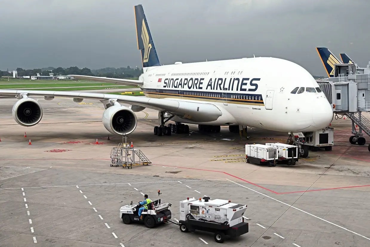 A Singapore Airlines Airbus A380 plane is parked on the tarmac at Changi International Airport in Singapore on October 24, 2020. Photo by AFP