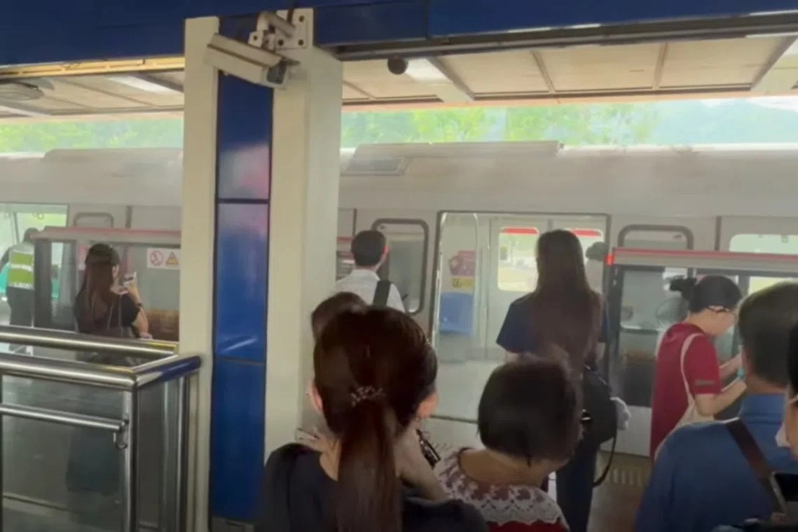 Commuters were guided off a train at Singapore’s Bukit Gombak station as smoke was seen coming out from underneath, Sept. 15, 2026. Photo courtesy of Facebook