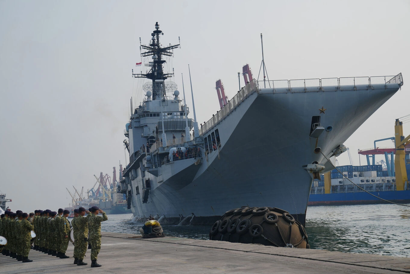 Indonesian Navy personnel salute as the Giuseppe Garibaldi, a former Italian Navy aircraft carrier, arrives at Tanjung Priok port in Jakarta, Indonesia, Friday, Sept. 18, 2026. Photo by AP