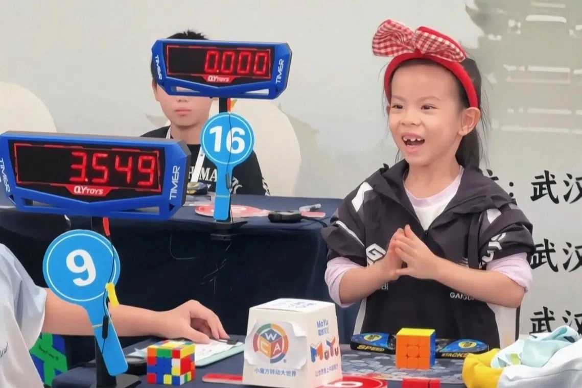 Young speedcuber Lian Yunzhi. Photo by Reuters