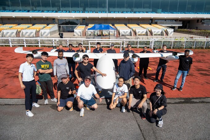 James Wang and his team with their 8-meter wingspan eVTOL. Photo courtesy of NTU