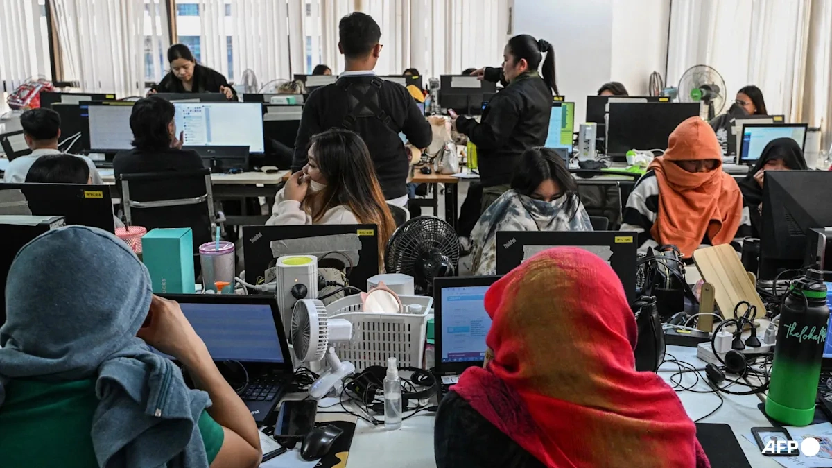 Workers during a raid on a suspected online scam farm in Manila on Jan. 31, 2025. Photo by AFP