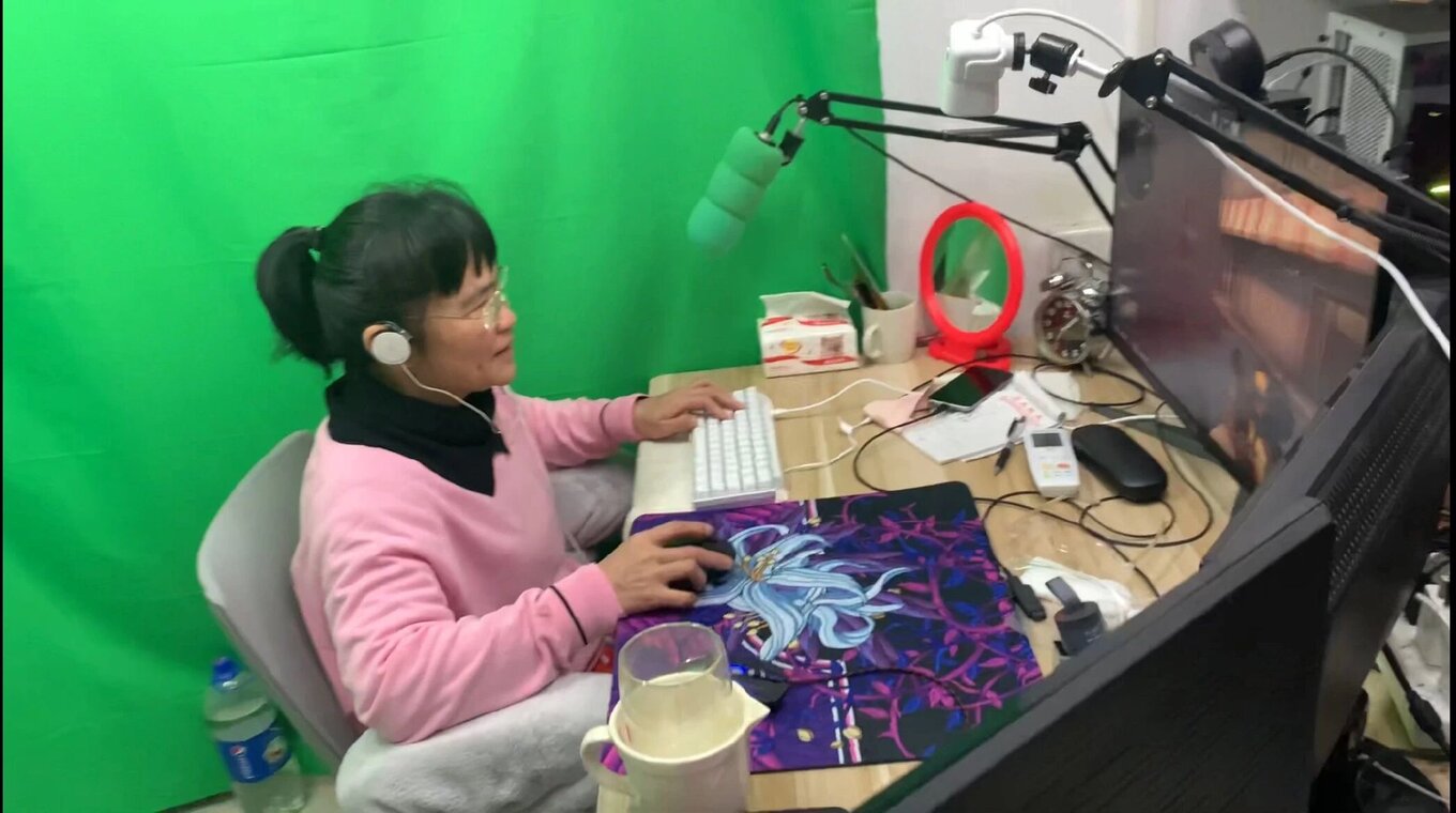 Zhong Juanjuan plays a video game in front of a green screen in February 2022. Photo courtesy of Zhong Juanjuan